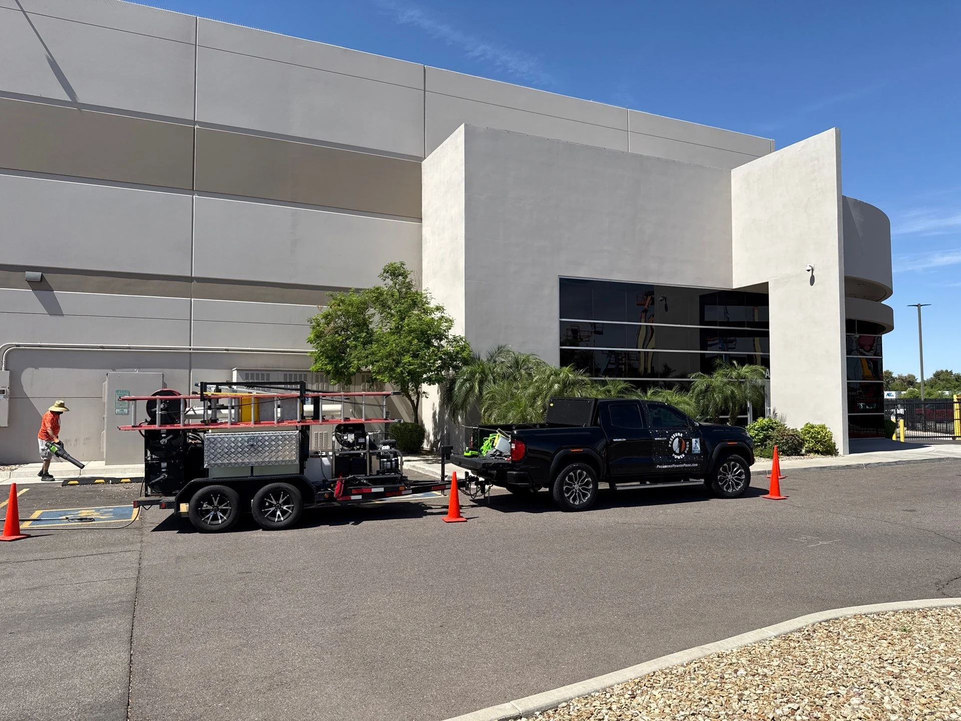 Commercial exterior building being pressure washed